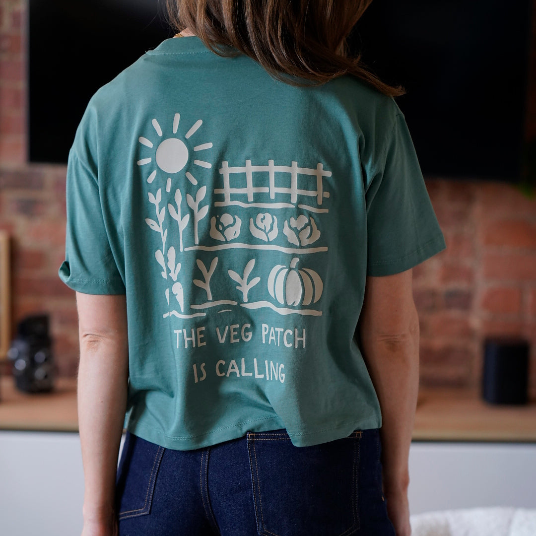 woman wearing a veg pach graphic tee in green